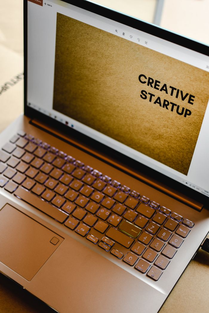 services-03 Laptop displaying Creative Startup concept in an inspiring workspace.